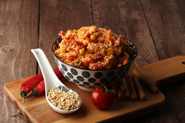 Delicious vegetarian quinoa salad with bell pepper, cucumber and tomatoes