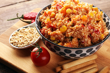 Delicious vegetarian quinoa salad with bell pepper, cucumber and tomatoes