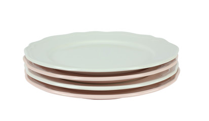 Pile of pink and white fine porcelain plates on white