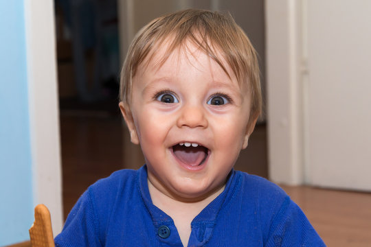 Cute baby is eating snack
