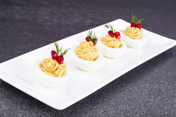 Festive snack stuffed eggs