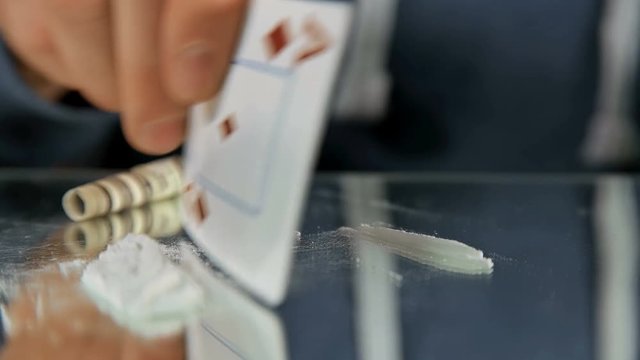 man makes a trail of drugs