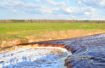 Small waterfall on river.