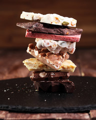 Melting chocolate and diffrent bars - stack and chips with choco