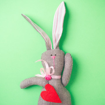 Easter bunny on a green background. Rabbit. Easter ideas. Easter eggs. Space for text.