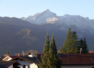 Fototapeta na wymiar The Bavarian Alps Mountain in the Morning Sunlight, View from Garmisch-Partenkirchen, in Germany 