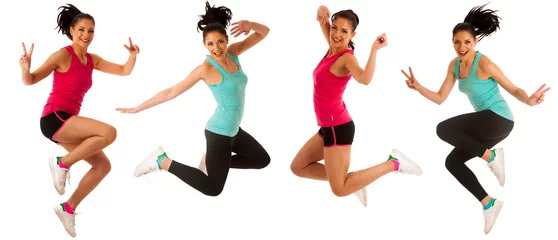 Fotobehang Happy fit and slim woman dancing and jumping isolated over white background © Samo Trebizan