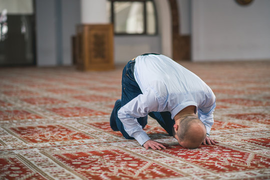 Humble Muslim prostrating in prayer
