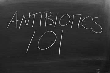 The words "Antibiotics 101" on a blackboard in chalk