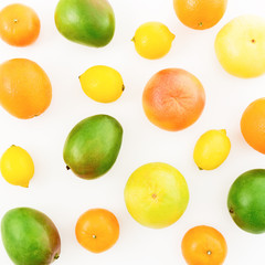 Fruits - lemon, orange, grapefruit, sweetie and mango isolated on white background. Flat lay, top view. Summer background