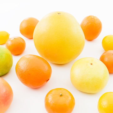 Citrus fruits - lemon, orange, grapefruit, sweetie and pomelo isolated on white background. Summer background