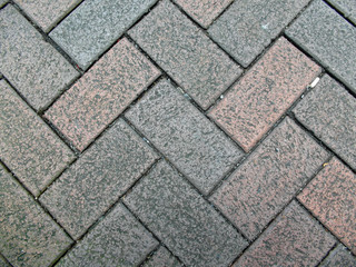 Brick pavement patterns on the ground.
