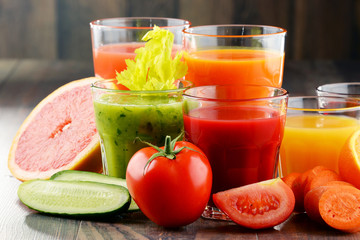 Glasses with fresh organic vegetable and fruit juices