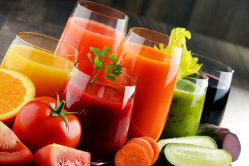 Glasses with fresh organic vegetable and fruit juices