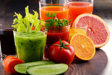 Glasses with fresh organic vegetable and fruit juices