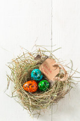 Various eggs for Easter on old white table