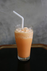 Cool Traditional Thai tea on food table.