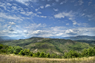 Obraz premium Beautiful summer landscape in mountains, green meadows and the dark blue sky with clouds . Big Caucasus. Azerbaijan