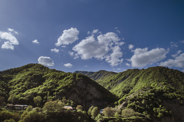 Obraz premium Cycling mountain road. Misty mountain road in high mountains.. Cloudy sky with mountain road. Big Caucasus. Azerbaijan Lahic