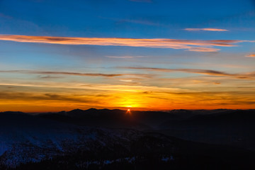 Beautiful sky sunset in winter mountains. Carpathian. Ukraine. Europe