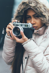 Young Beautiful female photographing on the street