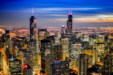 view of the Chicago city at night with skyscrapers lit