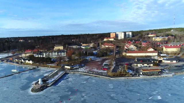 Taalintehdas town, UHD Aerial view 90 degree orbit around Taalintehdas town, on a sunny winter day, in finnish archipelago, in Kemi&ouml;nsaari, Varsinais-suomi, Finland