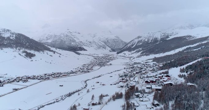Aerial view over Livigno alps ski resort, winter valley landscape, Italy