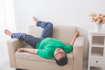 lazy Fat obese man sleeping on the couch