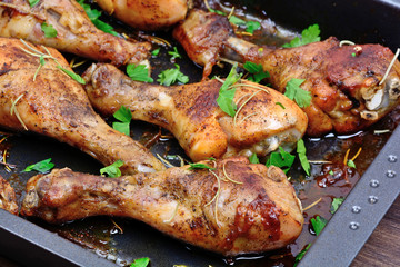 Chicken thighs tray on table