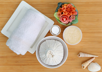 Top view Spa herbal compressing ball with towels and Salt Scrub, Spa concept background