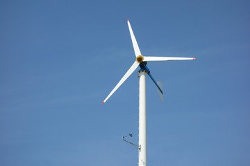 small wind turbine for electric on sky background   © lunglee