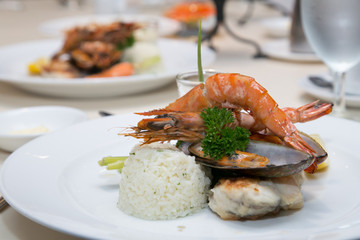 Pan Sear Sea bass, Tiger Prawn, NZ Mussel, Garlic Rice with Market Vetetable and Cream Leek Sauce