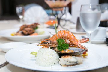 Pan Sear Sea bass, Tiger Prawn, NZ Mussel, Garlic Rice with Market Vetetable and Cream Leek Sauce