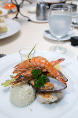 Pan Sear Sea bass, Tiger Prawn, NZ Mussel, Garlic Rice with Market Vetetable and Cream Leek Sauce