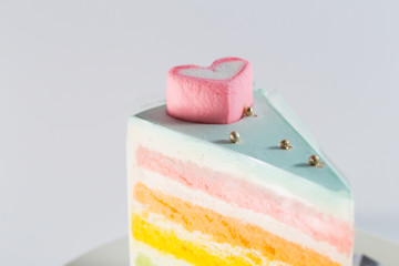 Rainbow cake on white background