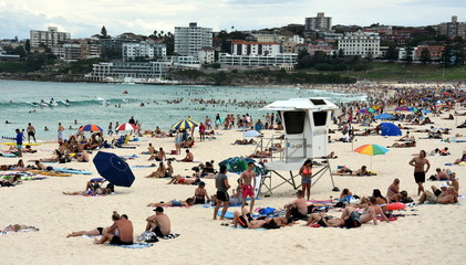 Sydney, Australia - Feb 5, 2017. People relaxing, swimming and sun bathing on Bondi beach. Bondi beach is one of the most famous tourist sites in Australia.