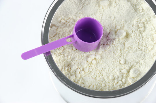 High Angle View Of Baby Formula And Spoon In Can