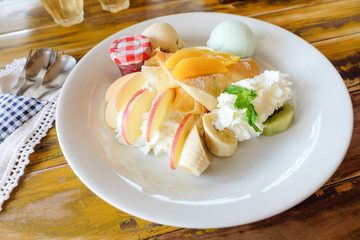 crepe with fresh fruit  on wooden table