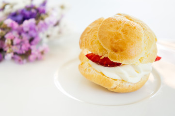 Homemade, Homemade cake, Choux Cream with fresh blueberry and strawberry decorated on white background at house.