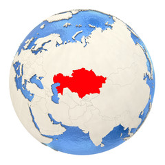 Kazakhstan in red on full globe isolated on white