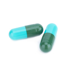 Two capsule color green and blue isolated on white background