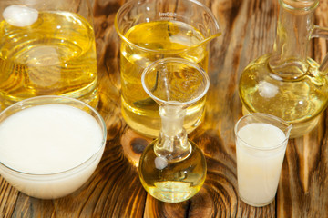 Bottle pouring virgin olive oil in a bowl close up