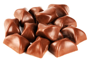 Chocolate candies over white