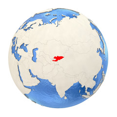 Kyrgyzstan in red on full globe isolated on white