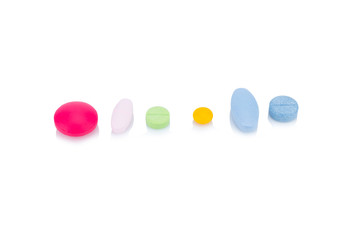 pill. tablet. various colors isolated on white background