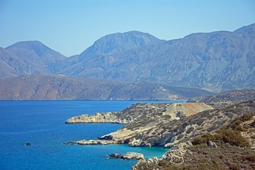 Fototapeta na wymiar Elevated view of the beach and rugged coastline near Ammoudara, Crete.