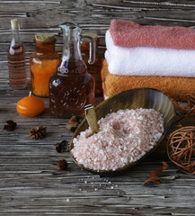 Set for spa with towels, salt and aromatic oils, selective focus