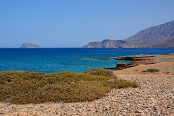 View of the sea and rugged coastline near Ammoudara, Crete.