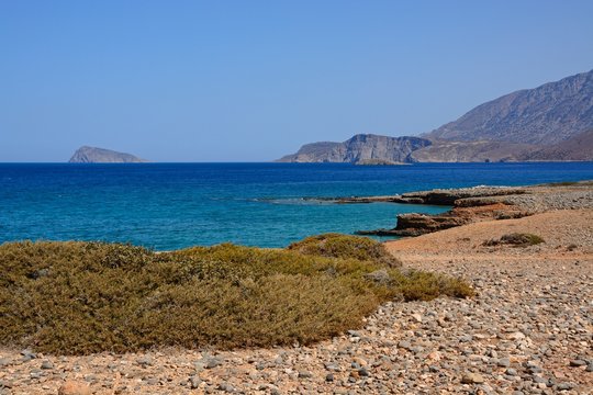 View of the sea and rugged coastline near Ammoudara, Crete.